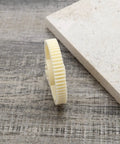 Beefed Up 61T 1 By 10 Spur Gear Replacement for Tamiya TT01 TT01D TT01E, durable plastic gear on textured surface.