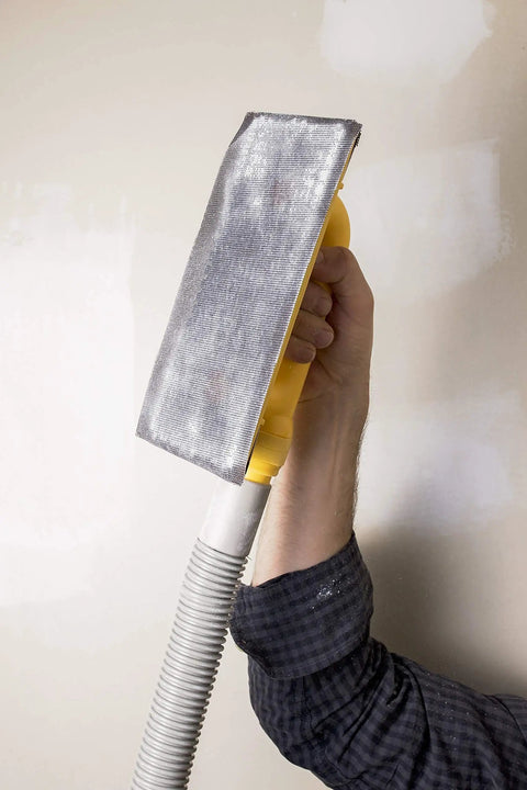 Hand holding Dust Free Drywall Vacuum Hand Sander with six foot hose for any wet dry vacuum Easy Clamp sanding screen replacement