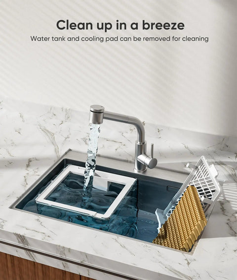 Water tank and cooling pad of Portable 3-In-1 Evaporative Air Cooler being cleaned in sink