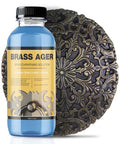 Brass patina solution bottle and ornate bronze plaque; blue bottle (100ml) labeled Brass Ager