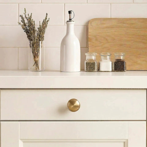 Champagne Bronze Cabinet Knobs Set Of 10 For Kitchen Cupboards And Dressers, Zinc Alloy Pulls, shown on white kitchen drawer