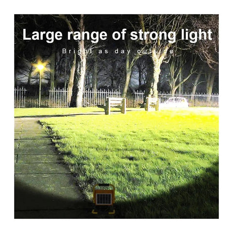 JUDYSSY 1000W Solar Flood Light Portable Led Reflector Spotlight illuminating a garden, showcasing strong light range at night.