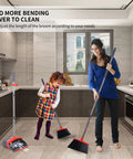Extended Telescoping Broom And Dustpan Set With Adjustable Handle For Zero Bend Sweeping, used for easy cleaning in a kitchen.