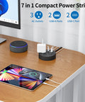 2 Prong To 3 Prong Outlet Adapter Power Strip With 180 Degree Rotating Plug on desk powering tablet and devices