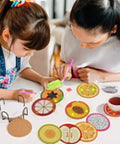 Adults and child using Diamond Art Coaster Kit With Holder, 12 Piece DIY Diamond Dot Coasters For Adults And Newbies, Includes Cork Bases, Colorful Diamonds, Glue, Pen, Tray, Holder And All Accessories, Fruit Style Craft Project.