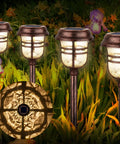 Six Pack RGBW Solar Pathway Lights Outdoor With Auto On Off IP65 Waterproof LED Garden Path Lights illuminating a garden