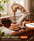 3D Wooden Harp Music Box Kit For Adults, Self Playing Mechanical Puzzle on a wooden table displaying intricate design details