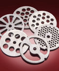 Six stainless steel grinding plates for STX Turboforce II Electric Meat Grinder, designed for various grinding textures.