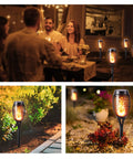Six Pack Solar Torch Lights With Realistic Flickering Flame illuminating garden and patio, enhancing evening ambiance.