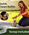 Woman refilling Squirrel-Proof Outdoor Bird Feeder That Delivers Mealworms And Seeds, Large 3-Pound Capacity, includes scoop.