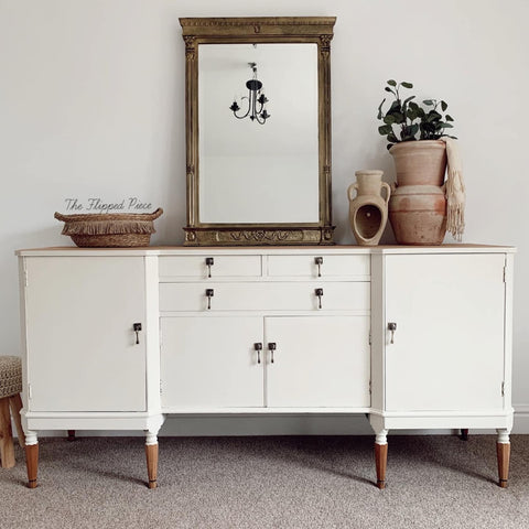 White sideboard painted with Chalk Mineral Furniture Paint In Drop Cloth, 32oz, Matte Linen White Finish For DIY Projects.