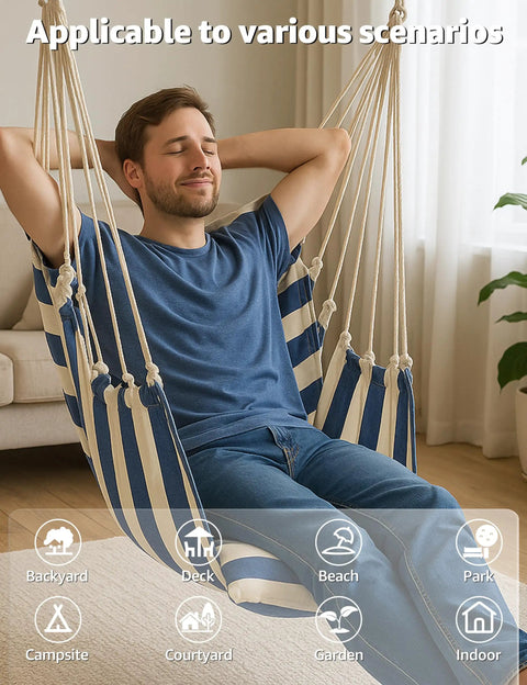 Man relaxing in a Chill Indoor Outdoor Hammock Chair Swing Set With Cushions And Pillows, 400 Lb Capacity Rope Chair In Soft Thick Cotton, Blue White Stripes