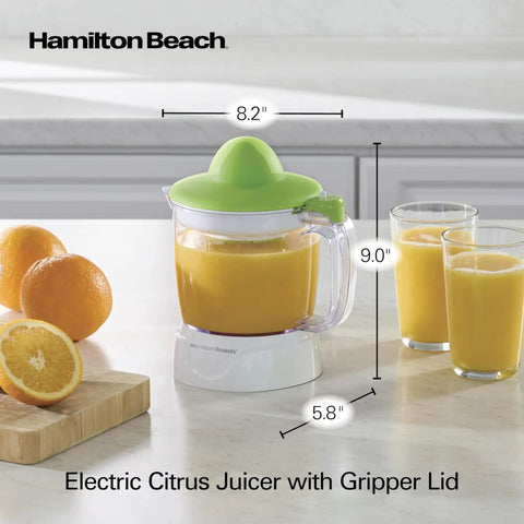 Hamilton Beach 34 Oz Electric Citrus Juicer With Silicone Gripper Lid easy press juice extraction on kitchen counter with oranges.