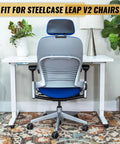 Steelcase Leap V2 chair with Heavy Duty Gas Cylinder Replacement For Steelcase Leap V2 Office Chair Side Activated Four And A Half Inch Height Adjustment 350 Newton Load 28mm Shaft Black Easy Install seated at a white desk.