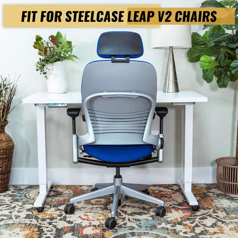 Steelcase Leap V2 chair with Heavy Duty Gas Cylinder Replacement For Steelcase Leap V2 Office Chair Side Activated Four And A Half Inch Height Adjustment 350 Newton Load 28mm Shaft Black Easy Install seated at a white desk.