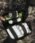 Open Tactical EMT Pouch Upgrade IFAK Tear Away First Aid Kit showing medical supplies in a compact nylon organizer