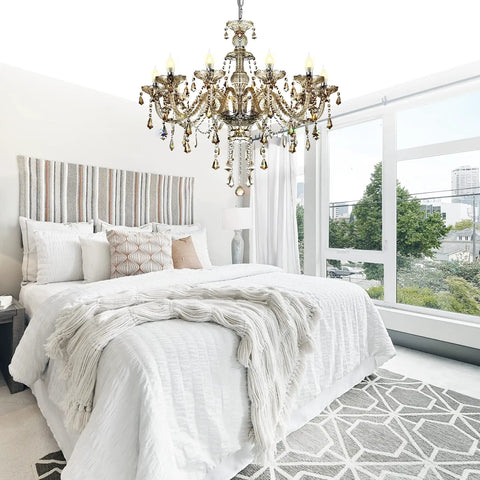 Bedroom with 10-Light Crystal Chandelier In Cognac Champagne Finish With K9 Crystal Beads above modern white bedding.