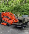 Compact 460 Mini Skid Steer Loader with Front Loader and Hydraulic Grapple Bucket on paved surface