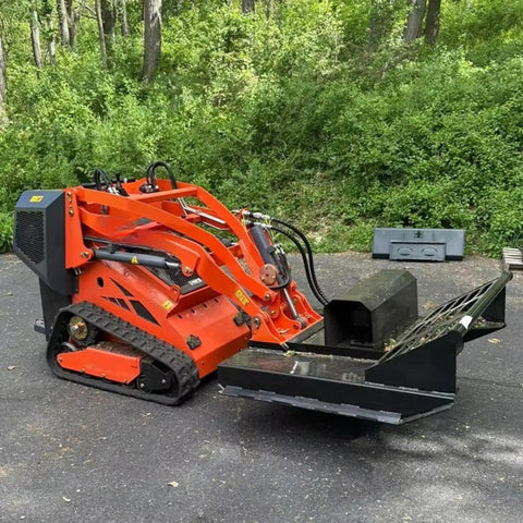 Compact 460 Mini Skid Steer Loader with Front Loader and Hydraulic Grapple Bucket on paved surface