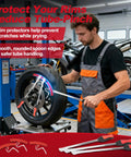 Mechanic using 38 Piece Tire Spoon Tool Set Heavy Duty With 14.5 Inch And 11.5 Inch Levers Pro Grade Rim Protectors in workshop
