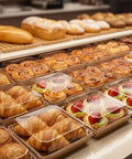Bakery display with pastries in 100 Pack Charcuterie Boxes With Clear Lids, 5.4 By 5 By 2.5 Inches Disposable Brown Square Food Containers