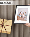 Two hands holding Classic Black 11x14 Picture Frame With Mat For 8x10 Photos Or 11x14 Without Mat, ideal gift suggestion.