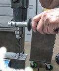 Person using Dope High Speed Steel Drill Bit Set 1.0 To 13.0 Millimeter Increments In 0.5 Millimeter Steps 25 Piece on metal plate