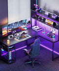53 Inch L Shaped Gaming Desk With Hutch And Headphone Hook Corner Computer Table With Extra Storage Shelves Built In Cable Management For Home Office Black set up with monitors and chair.