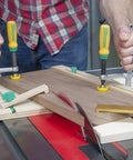 Person using Matchfit Dovetail Clamp Pro Router Bit Kit With One Half Inch Shank And Fourteen Degree Bit For Precision Dovetail Routing In Woodworking Track System Includes Clamps Setup Gauge Hardware Pack And Manual on wooden board.
