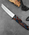 Knife with a G10 Knife Handle Material Block With Five Color Damascus Pattern Options For DIY Knife And Gun Handle Crafting, Precision Cut 5.1 By 1.7 By 0.3 Inches, Multicolor, laying on textured surface.