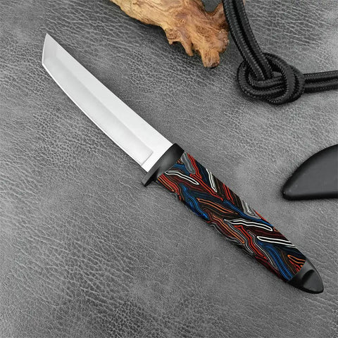 Knife with a G10 Knife Handle Material Block With Five Color Damascus Pattern Options For DIY Knife And Gun Handle Crafting, Precision Cut 5.1 By 1.7 By 0.3 Inches, Multicolor, laying on textured surface.