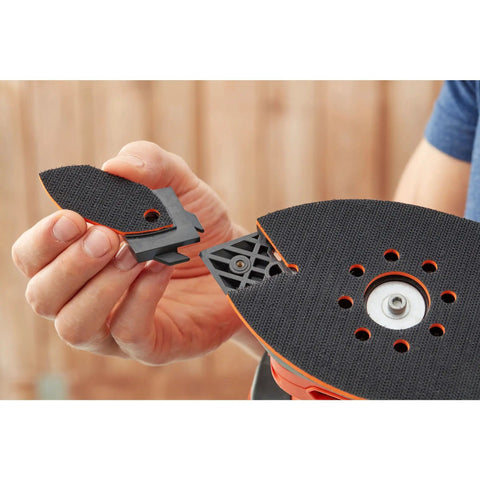 A hand holding a triangular sanding head attachment for Pick Up This Bad Boy Heavy Duty Multi Sander With 200 Watt Motor, 4 In 1.