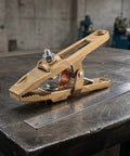 Heavy Duty Brass Welding Ground Clamp For Stick Mig Tigs And Cutting Tasks With Secure Locking Set Screws For Solid Earth Wire Connection In Professional Shop Settings on a workshop table.