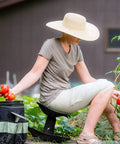 Person using Premium Garden Rocker With Cushion, Cover And Pockets For Easy Weeding And Planting Tool, Ergonomic, Model GB1227