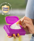 Person pulling a tissue from Snap And Go Ultra Soft Facial Tissues Travel Size Four On The Go Packs With Twenty Five Tissues Per Pack Three Ply Keeps Tissues Clean And Ready For Anywhere Packaging May Vary