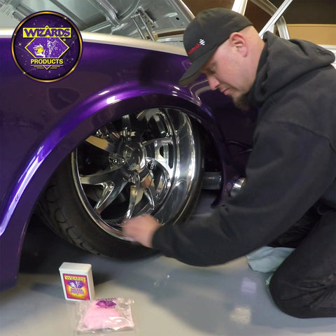 Wizards Metal Polish 3oz for silver, brass, stainless & aluminum; applied to chrome wheel of purple car (front view)