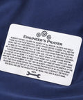 Stainless steel Engineer's Prayer wallet card on blue fabric, part of Techie Engineer Gift For Men Engineers Prayer Wallet Card Featuring Electrical And Mechanical Engineering Themed Jewelry For Engineers A Solid Fathers Day Retirement Gift For Dad Or Grandfather.
