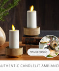 Outdoor Flameless LED Votive Candle Set of 2, Ivory 1.5 x 4 Inches, Moving Flame on table with plant and decor.