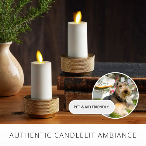 Outdoor Flameless LED Votive Candle Set of 2, Ivory 1.5 x 4 Inches, Moving Flame on table with plant and decor.