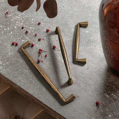 Vintage Brass Zinc Alloy Cabinet Handles Set Of 6 5.03 Inch Center To Center Antique Retro Pulls on stone surface