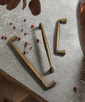 Killer Vintage Antique Brass Cabinet Handles Slick Zinc Alloy Pulls Rock Solid Kitchen Drawer Hardware on gray surface.
