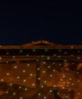 Motion Snow Fall Light Show With White Laser And 7 Color Star Effects Christmas Lights on house facade, night view