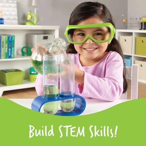 Child playing with Primary Science Deluxe Lab Kit For Kids 45 Piece Preschool STEM Toys Set, wearing safety goggles in a classroom.