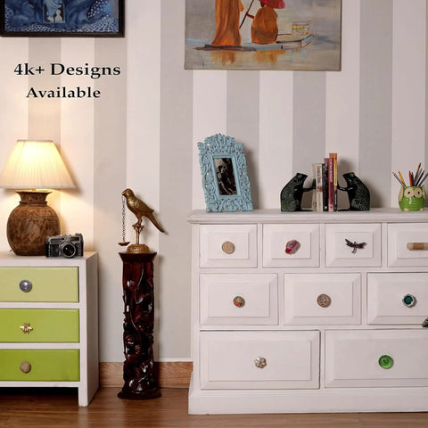 White dresser with 50 piece black wheel flat ceramic drawer knobs for kitchen cabinets and furniture doors visible.