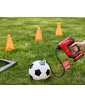 Person using V20 Cordless Tire Inflator And Portable Air Compressor With Digital Pressure Gauge Up To 150 Psi on soccer ball