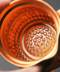 Close-up view inside a copper Turkish Coffee Pot Cezve Set With 300ml Coffee Maker And Cup, showing the hammered texture.