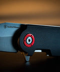 Close-up of Compact 2.5 Inch Folding Keychain Knife with 1.75 Inch Modified Tanto Blade and G10 Handle for Outdoor EDC Survival.