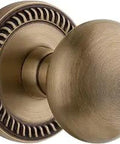 Newport Rosette With Fifth Avenue Knob Door Hardware Set For Passage Two And Three Eighths Inch Backset Vintage Brass Finish
