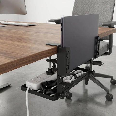 Adjustable Under Desk Laptop Holder With Integrated Cord Organizer Rack Quick Grip Edge Clamp showing laptop and power cords under desk.