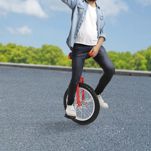 Person riding 16 Inch Adjustable Unicycle For Outdoor Fitness And Fun, Rugged Ergonomic Design, red, on asphalt with blue sky